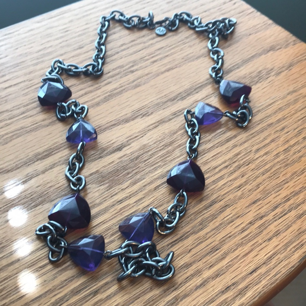 Long black chain necklace with purple stones.